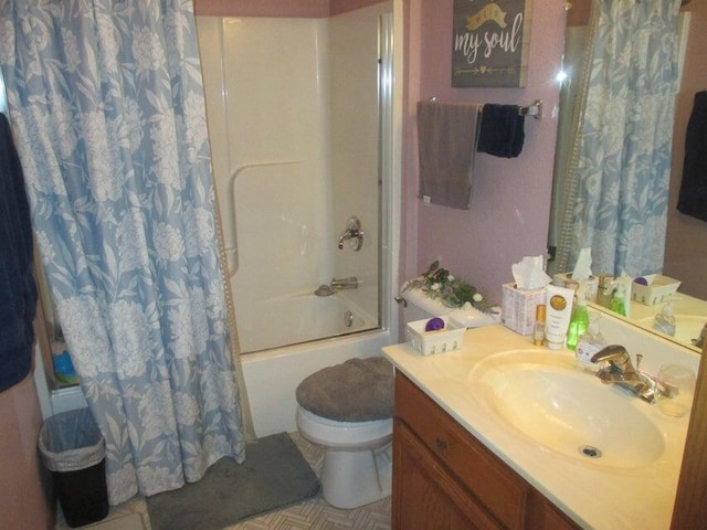 full bath featuring toilet, shower / tub combo with curtain, and vanity
