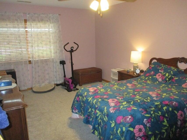 carpeted bedroom with a ceiling fan