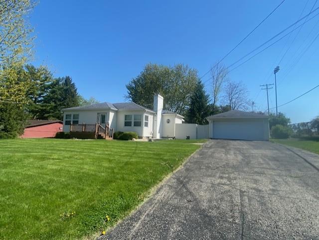 301 E Coldspring Ave, Madison, WI 53716 - ranch-style house featuring a front yard, a detached garage, a deck, and a chimney