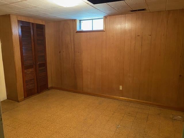 301 E Coldspring Ave, Madison, WI 53716 - basement featuring light floors and wooden walls