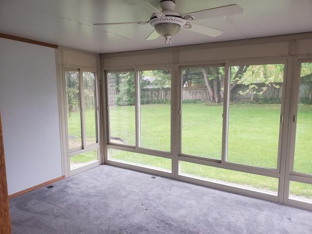 301 E Coldspring Ave, Madison, WI 53716 - unfurnished sunroom featuring carpet and baseboards
