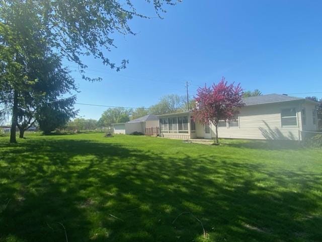 301 E Coldspring Ave, Madison, WI 53716 - view of green lawn with a sunroom