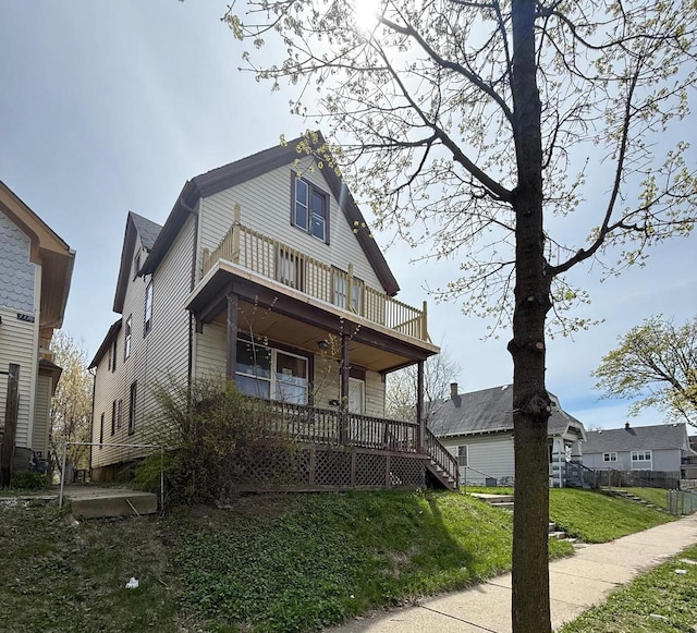 3332 N Richards St, Milwaukee, WI 53212 - view of front of property with a balcony, covered porch, and a front lawn