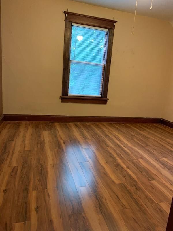 944 9th St, Beloit, WI 53511 - spare room with wood finished floors and baseboards