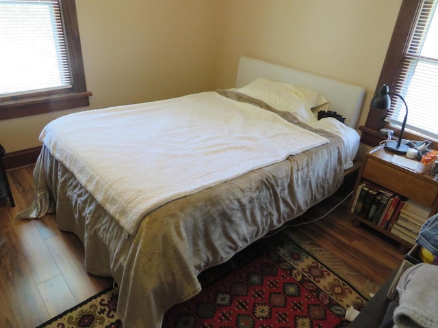 944 9th St, Beloit, WI 53511 - bedroom featuring wood finished floors and multiple windows