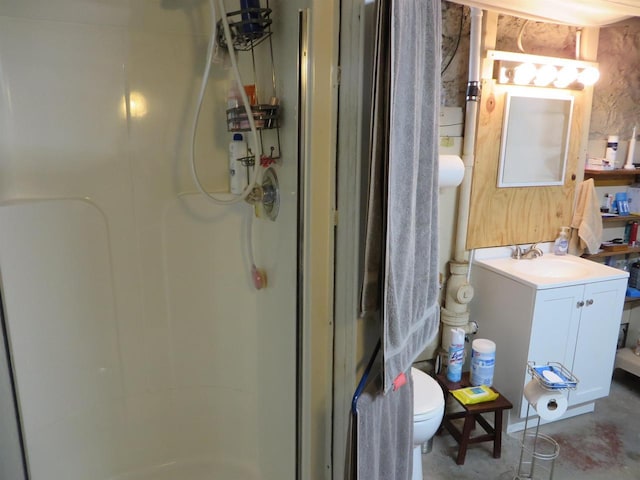 944 9th St, Beloit, WI 53511 - bathroom with a stall shower, toilet, vanity, and concrete floors