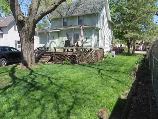 944 9th St, Beloit, WI 53511 - rear view of house with a deck and roof with shingles