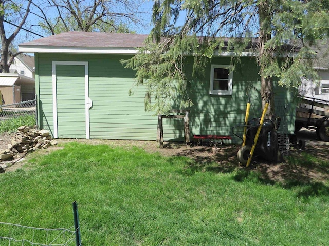 944 9th St, Beloit, WI 53511 - back of property with an outbuilding and a shingled roof