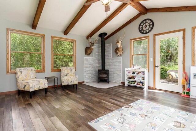 7929 N Pine View Dr, Edgerton, WI 53534 - living area with a wood stove, wood finished floors, baseboards, and ceiling fan
