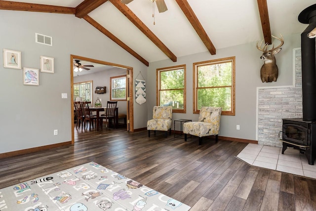 7929 N Pine View Dr, Edgerton, WI 53534 - sitting room featuring a wood stove, a ceiling fan, wood finished floors, and baseboards