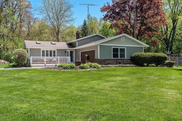 7929 N Pine View Dr, Edgerton, WI 53534 - split level home featuring a front lawn, an attached garage, a chimney, and brick siding