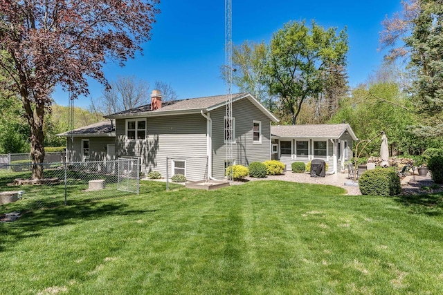 7929 N Pine View Dr, Edgerton, WI 53534 - rear view of property with a chimney, a patio area, and roof with shingles