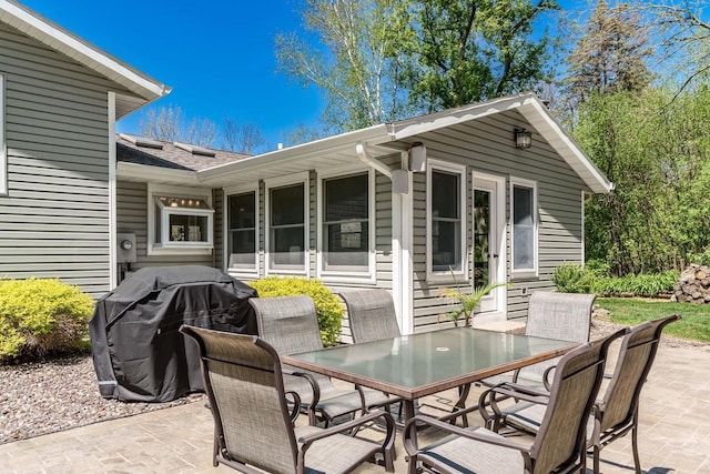 7929 N Pine View Dr, Edgerton, WI 53534 - view of patio / terrace with outdoor dining space and a grill