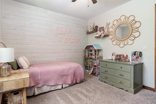 7929 N Pine View Dr, Edgerton, WI 53534 - carpeted bedroom with wooden walls and a ceiling fan