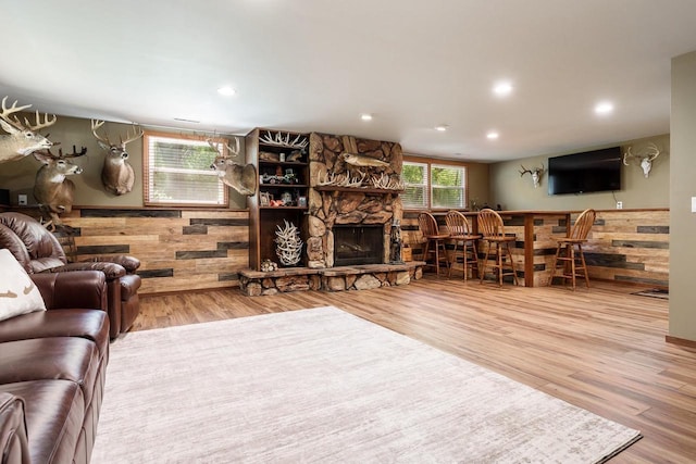 7929 N Pine View Dr, Edgerton, WI 53534 - living room with wood finished floors, a fireplace, recessed lighting, and wainscoting