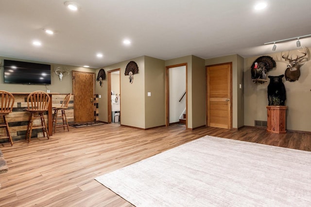 7929 N Pine View Dr, Edgerton, WI 53534 - living room featuring light wood-style floors, recessed lighting, stairs, and baseboards