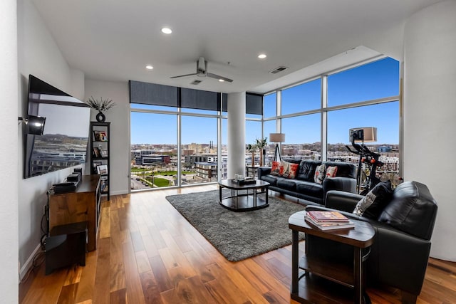 601 E Ogden Ave Unit 803, Milwaukee, WI 53202 - living area with ceiling fan, expansive windows, wood finished floors, recessed lighting, and baseboards