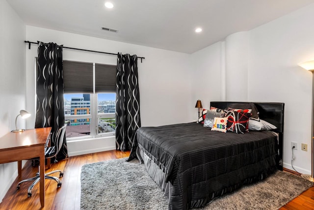 601 E Ogden Ave Unit 803, Milwaukee, WI 53202 - bedroom featuring wood finished floors, recessed lighting, an office area, and baseboards