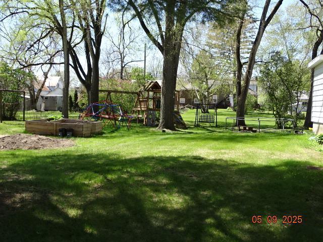413 S Howard St, Princeton, WI 54968 - view of yard featuring a garden and a playground