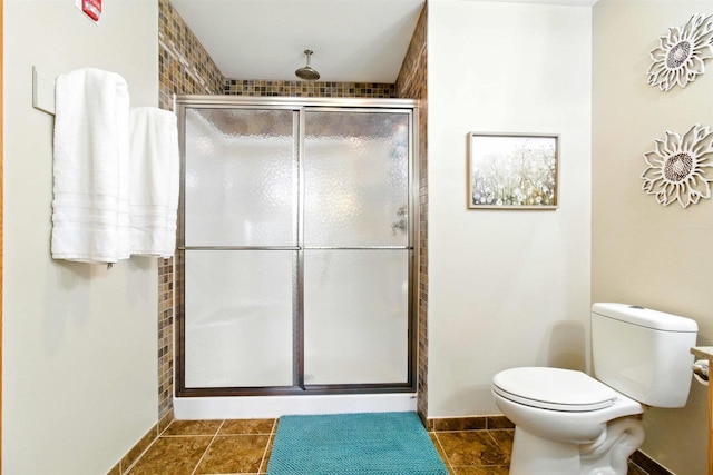 1822-3 Parkland Dr Unit 0703, Arkdale, WI 54613 - full bathroom with a stall shower, toilet, baseboards, and tile patterned flooring