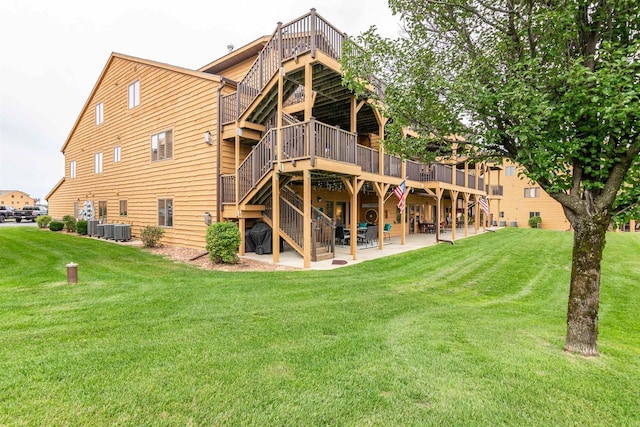 1822-3 Parkland Dr Unit 0703, Arkdale, WI 54613 - rear view of house featuring stairway, a wooden deck, a patio, a yard, and central air condition unit