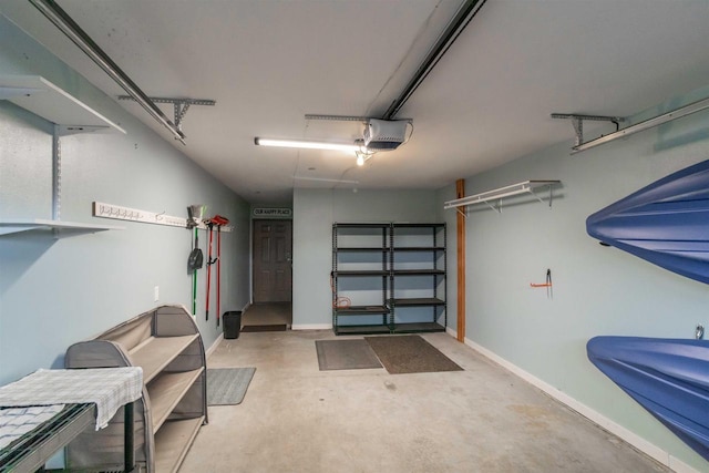 1822-3 Parkland Dr Unit 0703, Arkdale, WI 54613 - garage with a garage door opener and baseboards