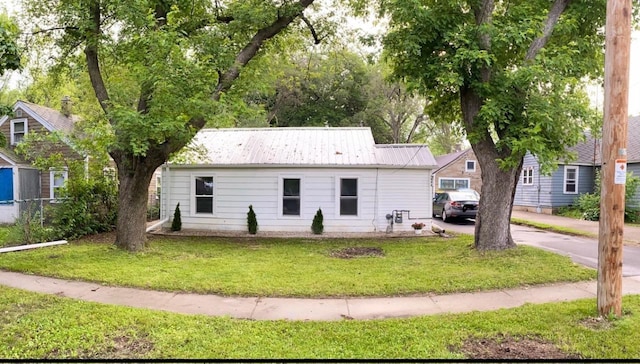1952 S Wisconsin Ave, Beloit, WI 53511 - view of front of home featuring a front yard and metal roof