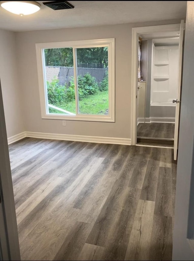 1952 S Wisconsin Ave, Beloit, WI 53511 - empty room with wood finished floors and baseboards