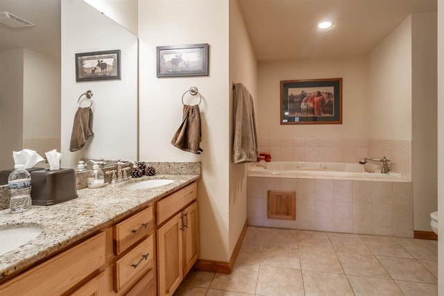 1839-6 20th Blvd Unit 0206, Arkdale, WI 54613 - bathroom with tile patterned floors, a garden tub, double vanity, and baseboards