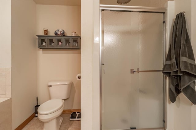 1839-6 20th Blvd Unit 0206, Arkdale, WI 54613 - bathroom with a shower stall, toilet, tile patterned flooring, and baseboards