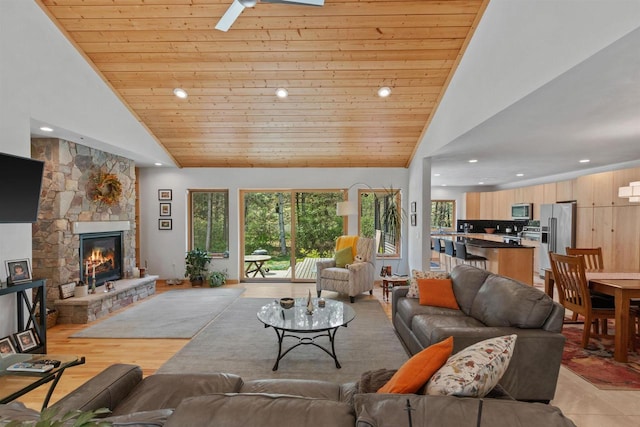 2191 County Road G, Nekoosa, WI 54457 - living area with plenty of natural light, high vaulted ceiling, recessed lighting, a stone fireplace, and wood ceiling