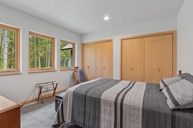 2191 County Road G, Nekoosa, WI 54457 - carpeted bedroom with multiple closets, baseboards, and recessed lighting