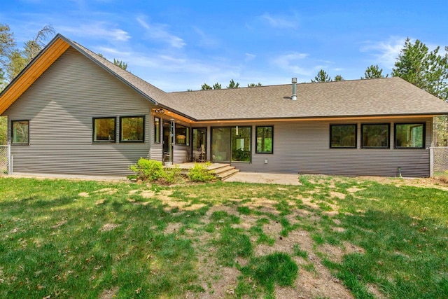 2191 County Road G, Nekoosa, WI 54457 - rear view of house featuring a patio area, a yard, and a shingled roof