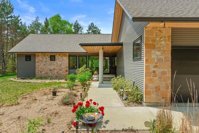 2191 County Road G, Nekoosa, WI 54457 - entrance to property featuring roof with shingles and stone siding