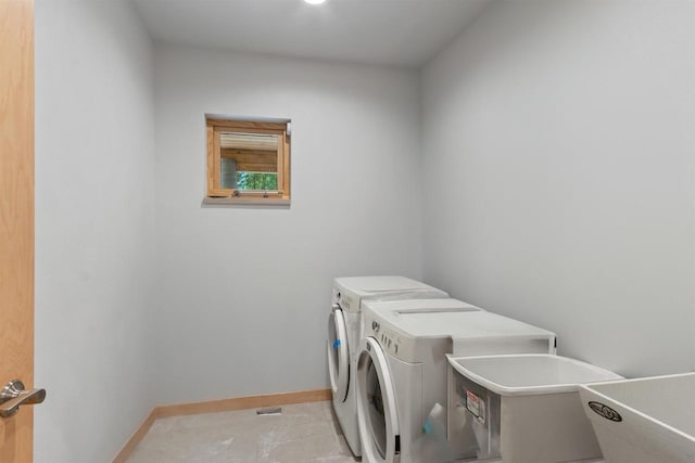 2191 County Road G, Nekoosa, WI 54457 - laundry area featuring washing machine and clothes dryer and baseboards