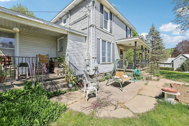 604 9th Ave, Baraboo, WI 53913 - back of property featuring a porch and a patio