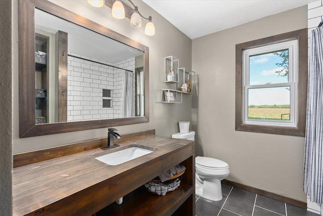 E7065 County Road B, Colfax, WI 54730 - bathroom featuring toilet, vanity, tile patterned floors, a shower with curtain, and baseboards