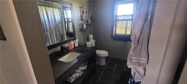 E7065 County Road B, Colfax, WI 54730 - bathroom featuring toilet, a shower with shower curtain, vanity, and tile patterned floors