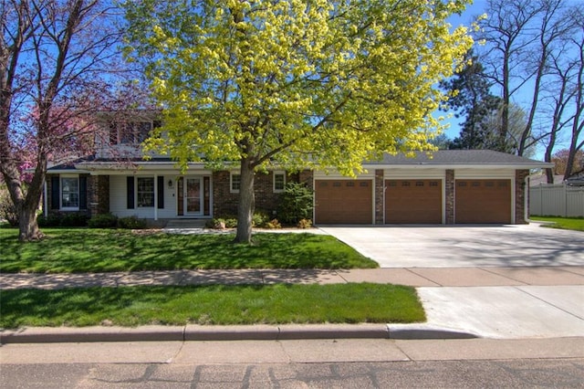 1206 Nixon Ave, Eau Claire, WI 54701 - view of front of home featuring an attached garage and concrete driveway