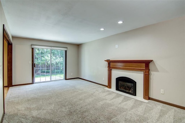 1206 Nixon Ave, Eau Claire, WI 54701 - unfurnished living room with carpet flooring, baseboards, and recessed lighting