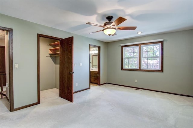 1206 Nixon Ave, Eau Claire, WI 54701 - unfurnished bedroom featuring light carpet, a spacious closet, baseboards, and a closet