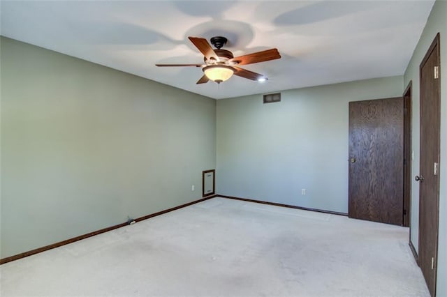 1206 Nixon Ave, Eau Claire, WI 54701 - spare room with a ceiling fan, light carpet, and baseboards
