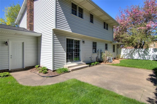 1206 Nixon Ave, Eau Claire, WI 54701 - back of house with a patio area and a chimney