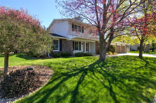 1206 Nixon Ave, Eau Claire, WI 54701 - traditional-style home with concrete driveway, an attached garage, and a front lawn