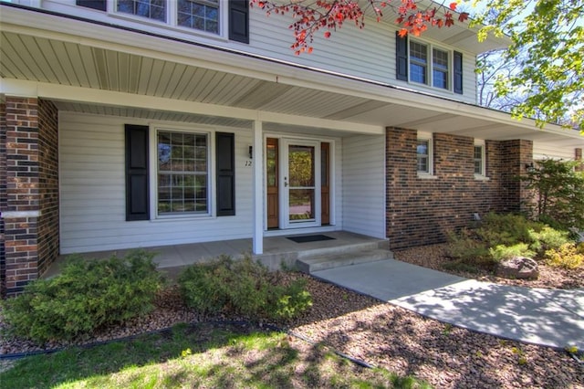 1206 Nixon Ave, Eau Claire, WI 54701 - entrance to property with a porch and brick siding