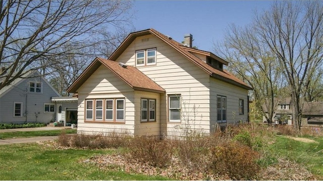 41 E Euclid Ave, Barron, WI 54812 - view of home's exterior featuring a chimney and a yard