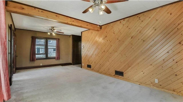 41 E Euclid Ave, Barron, WI 54812 - unfurnished room with carpet flooring, ceiling fan, wooden walls, baseboards, and beamed ceiling