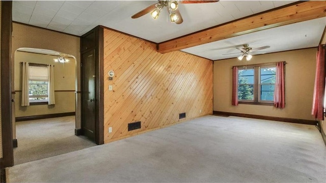 41 E Euclid Ave, Barron, WI 54812 - carpeted spare room featuring ceiling fan, baseboards, wood walls, and beam ceiling