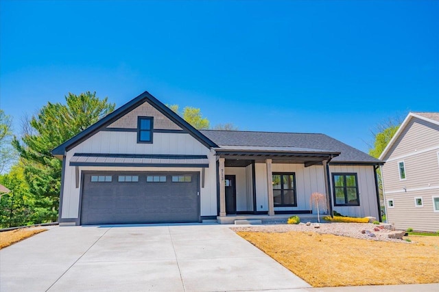 713 Kennedy St, Sauk City, WI 53583 - modern farmhouse featuring covered porch, board and batten siding, driveway, and a garage