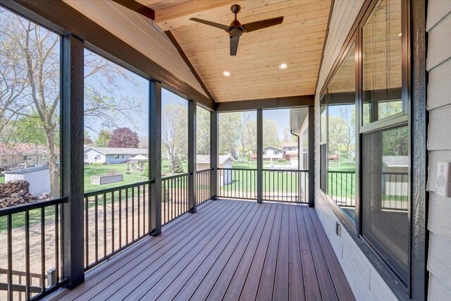 713 Kennedy St, Sauk City, WI 53583 - unfurnished sunroom featuring a ceiling fan, plenty of natural light, and a residential view